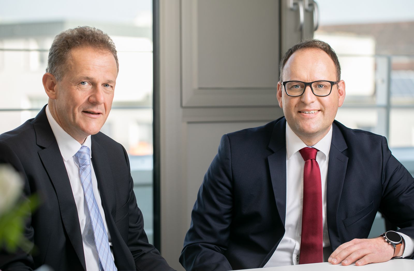 Portrait der beiden Notare Lutz und Feterowsky